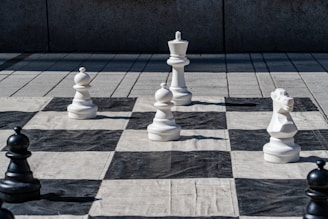 Giant chess pieces on a large outdoor board