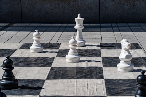 Giant chess pieces on a large outdoor board