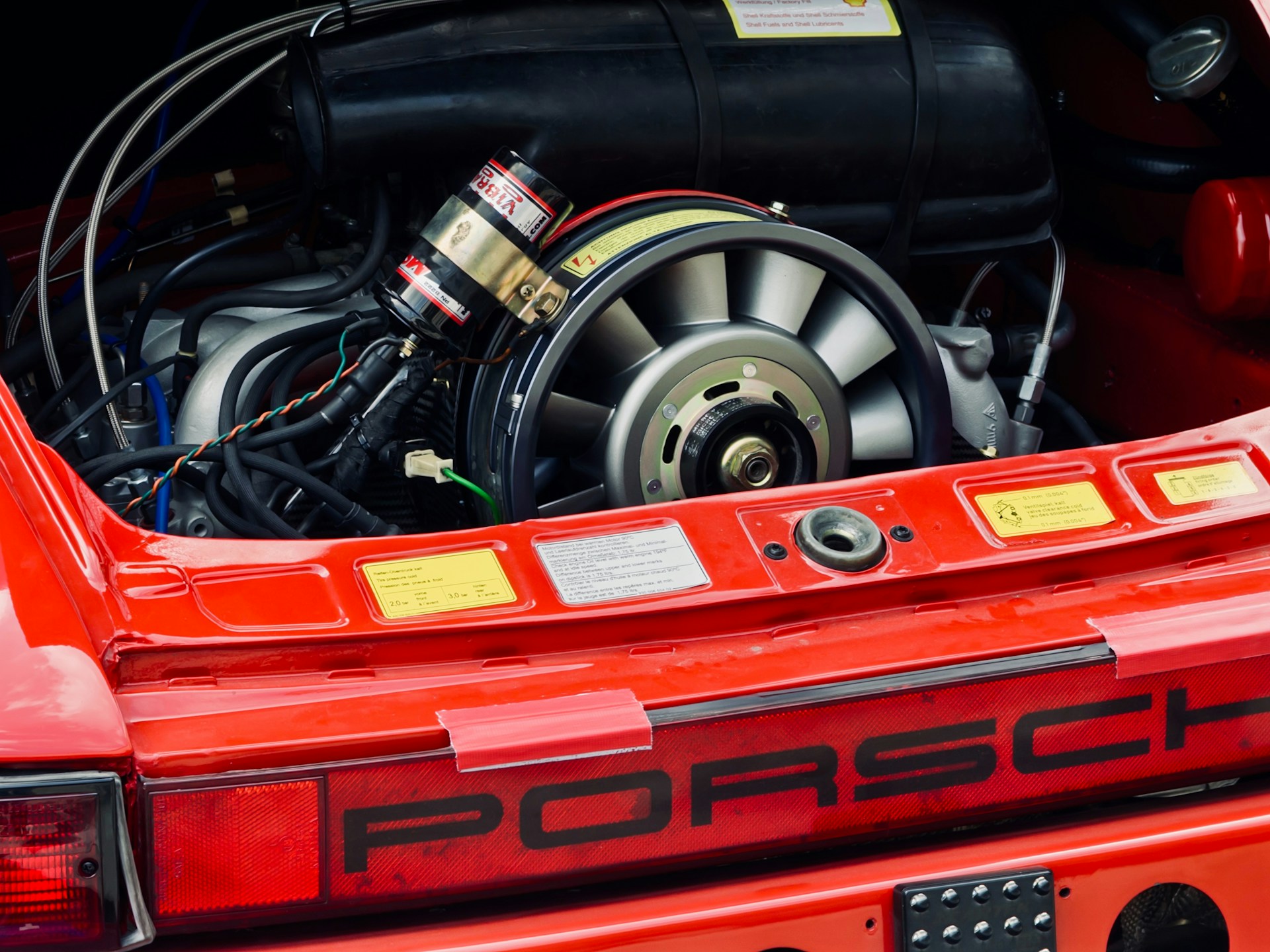 Detailed view of a classic red porsche engine.