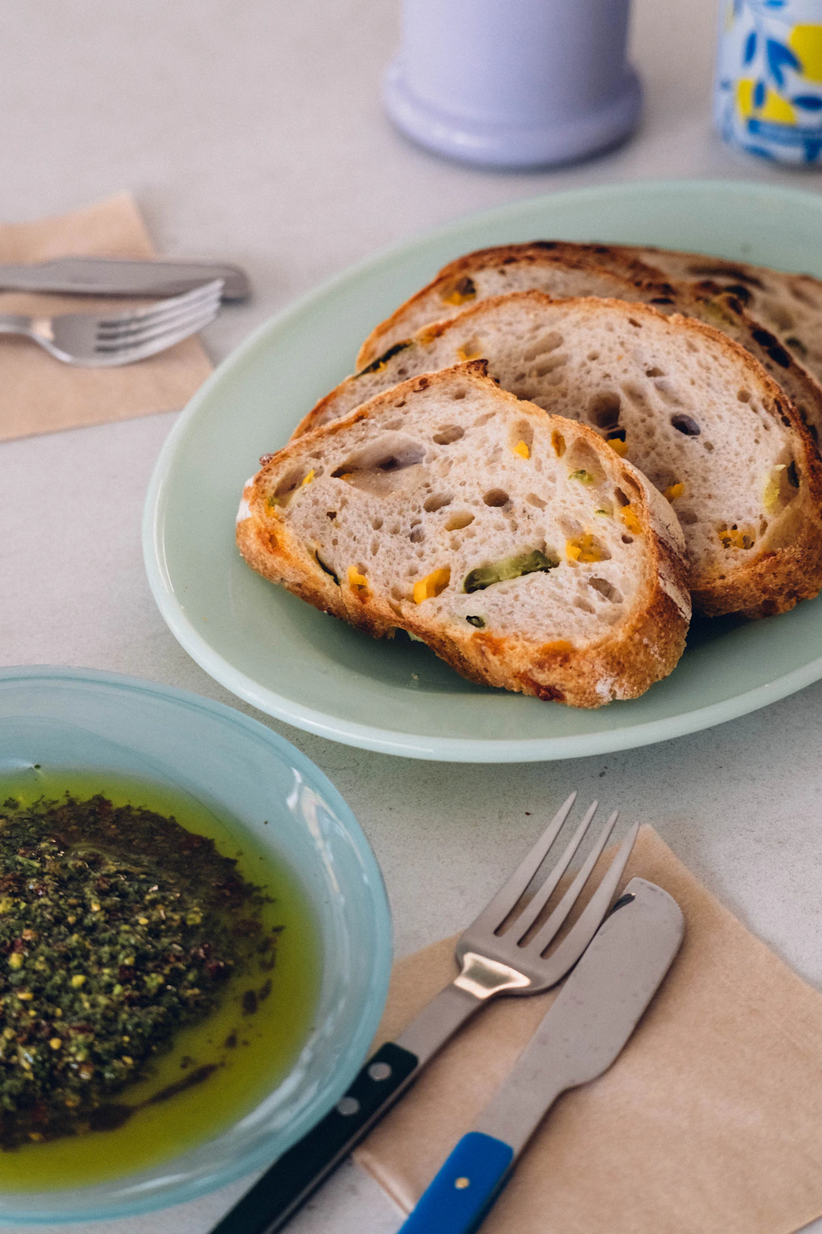Sliced bread with olive oil and herbs