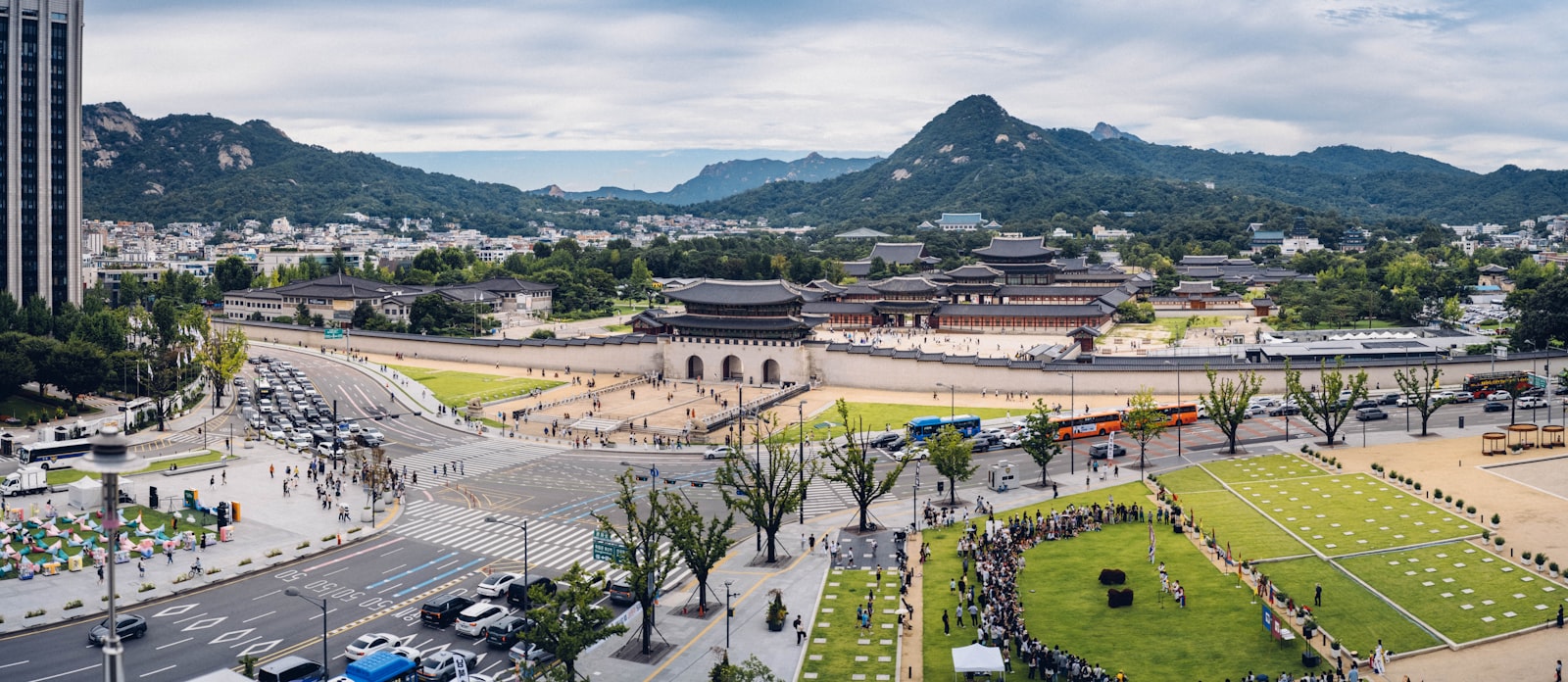 Aerial view of Gyeongbokgung Palace with the Bukhansan mountain range behind central Seoul