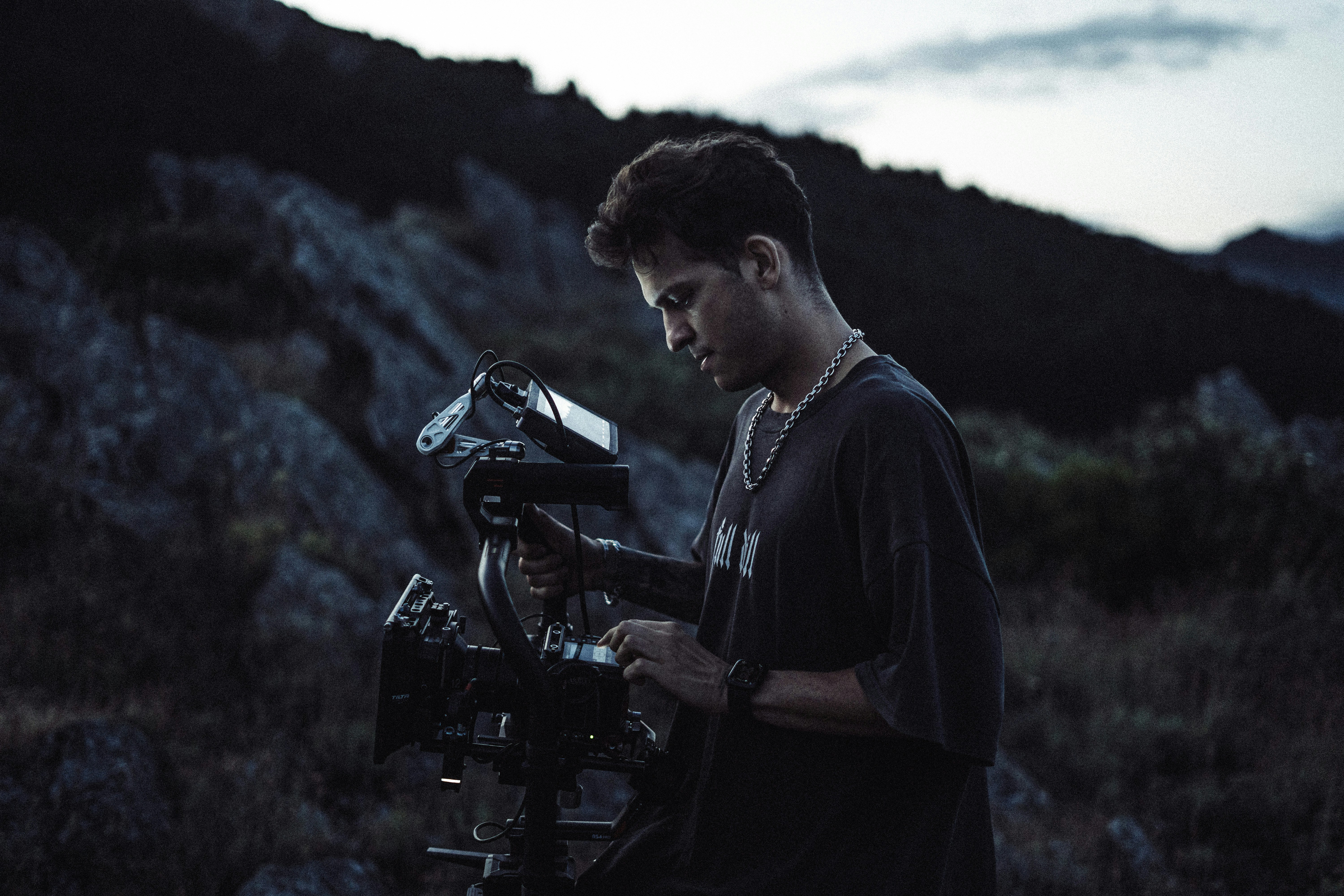 Filmmaker operating camera