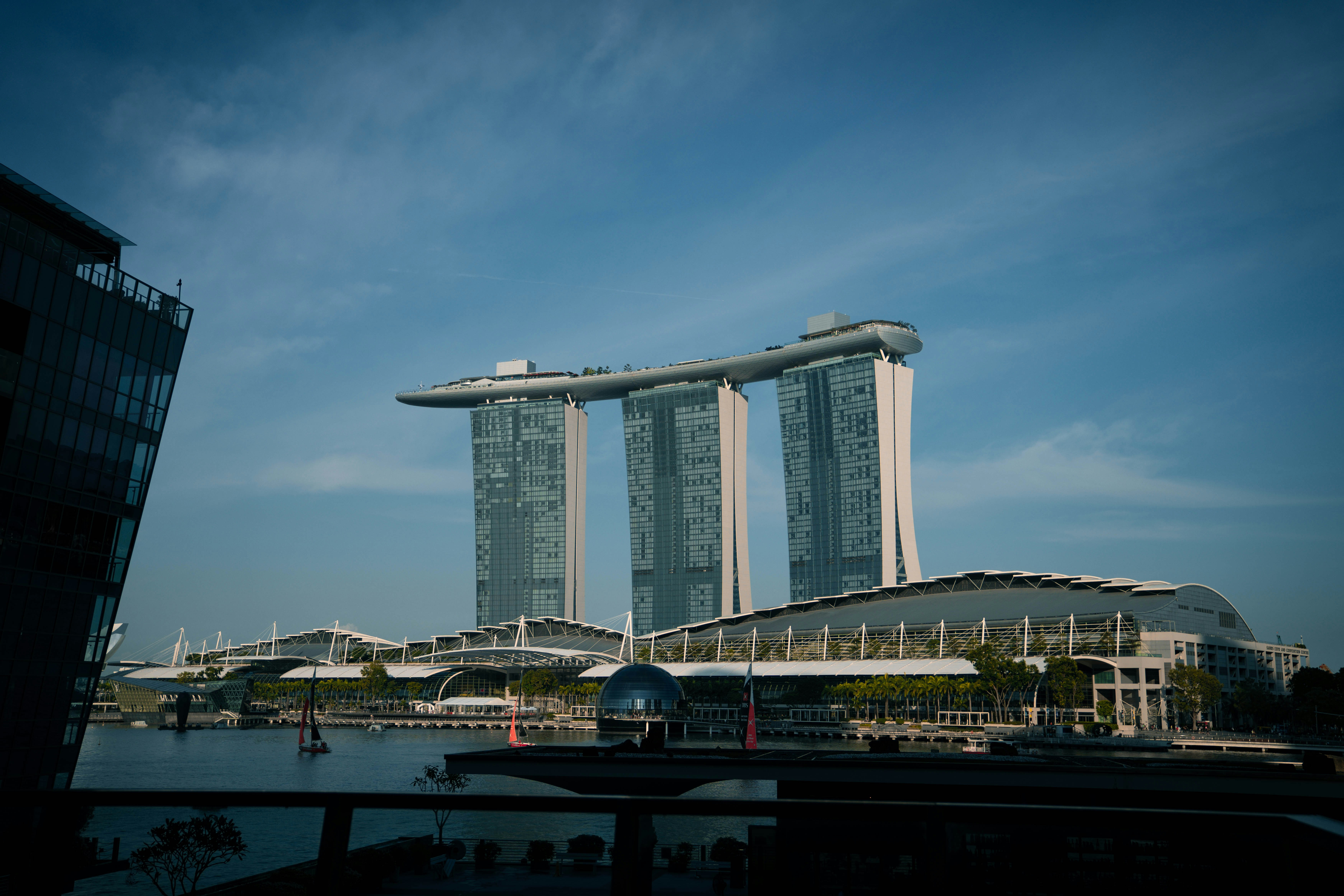 Modern skyscrapers with a sky bridge under blue sky