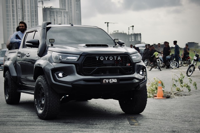 Black toyota gr sport pickup truck with snorkel.