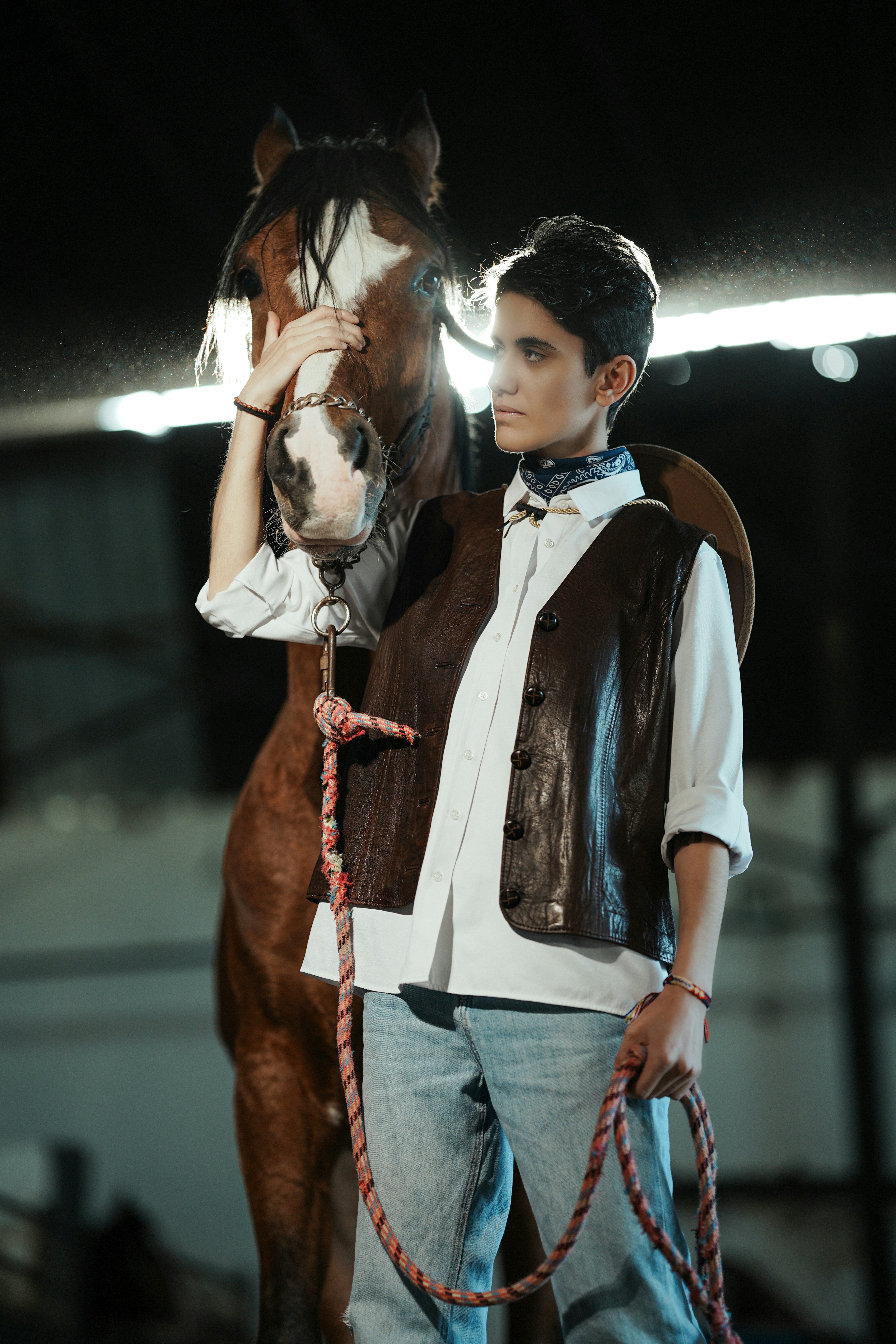 Person in western wear with a horse