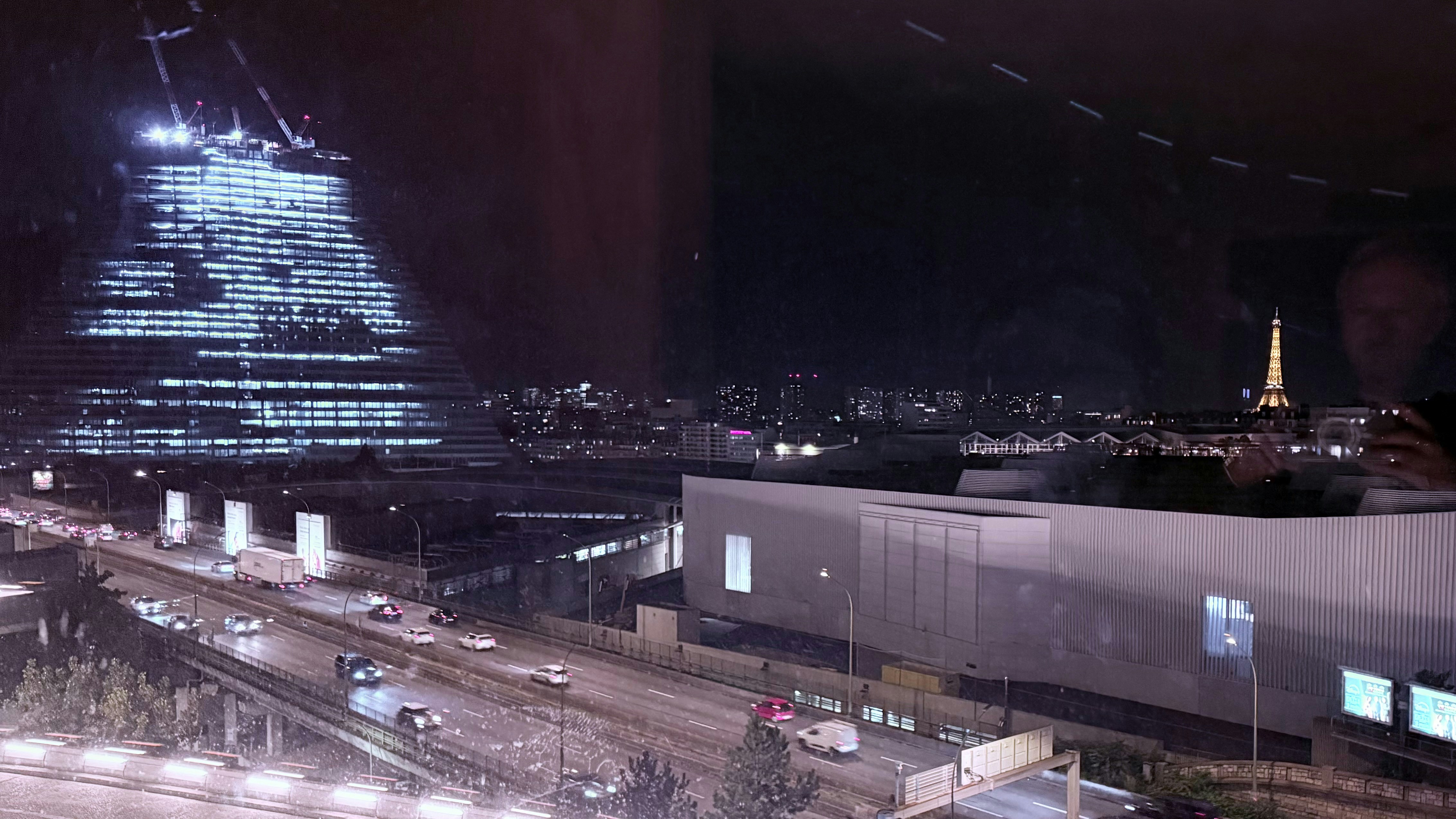 Illuminated skyscraper and cityscape at night