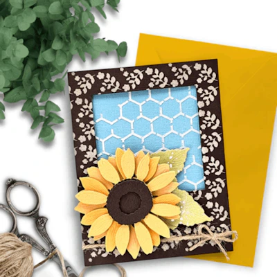 Handmade sunflower card with brown floral border and yellow envelope