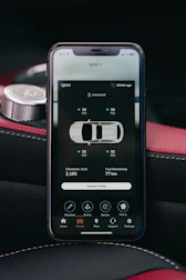 Smartphone displaying car tire pressure monitoring system