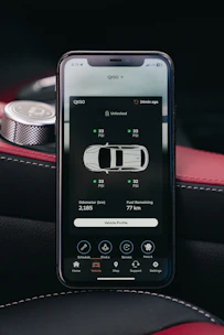 Smartphone displaying car tire pressure monitoring system