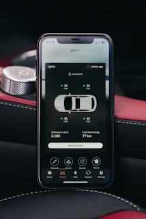 Smartphone displaying car tire pressure monitoring system