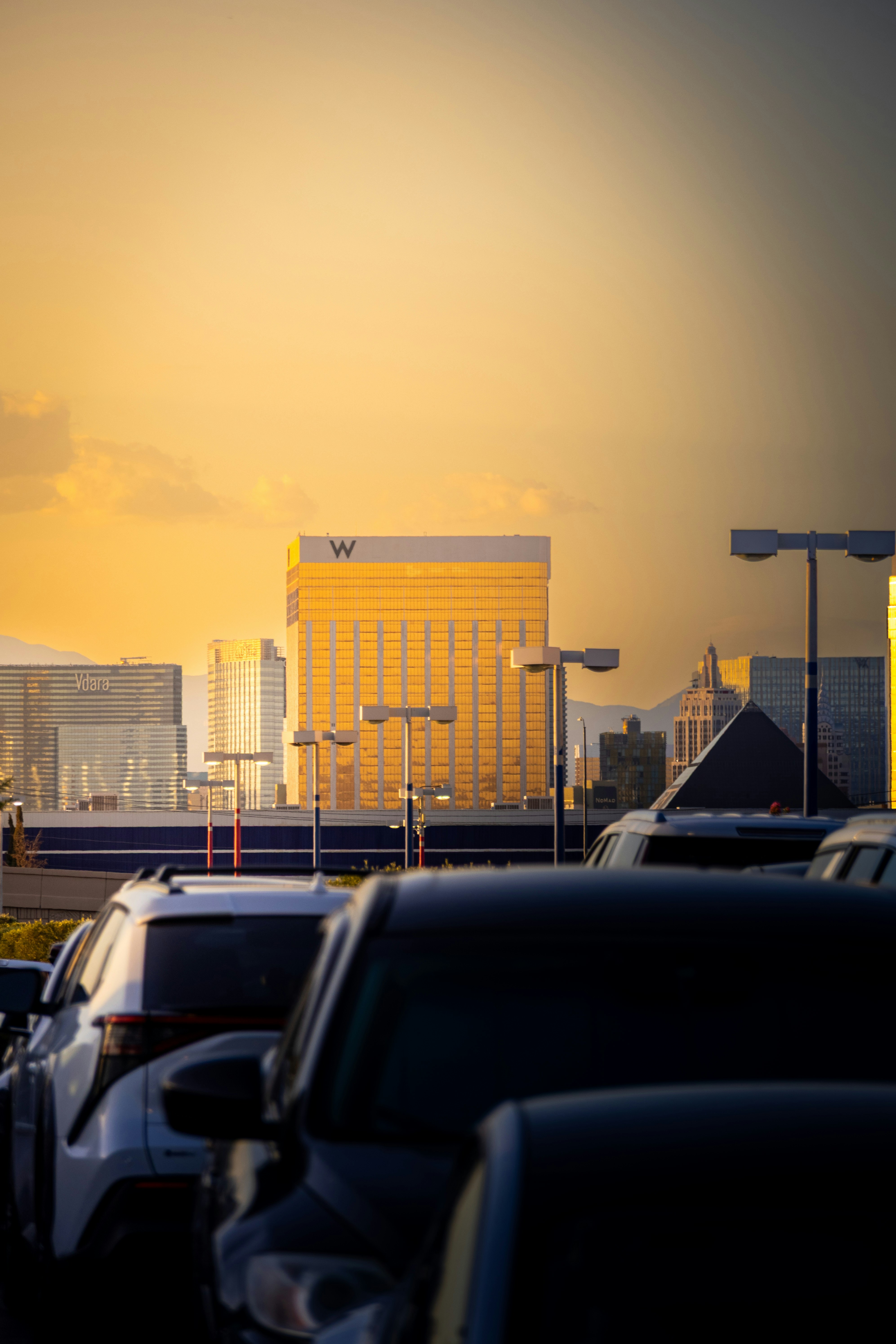 Golden hour illuminates buildings and cars in las vegas.