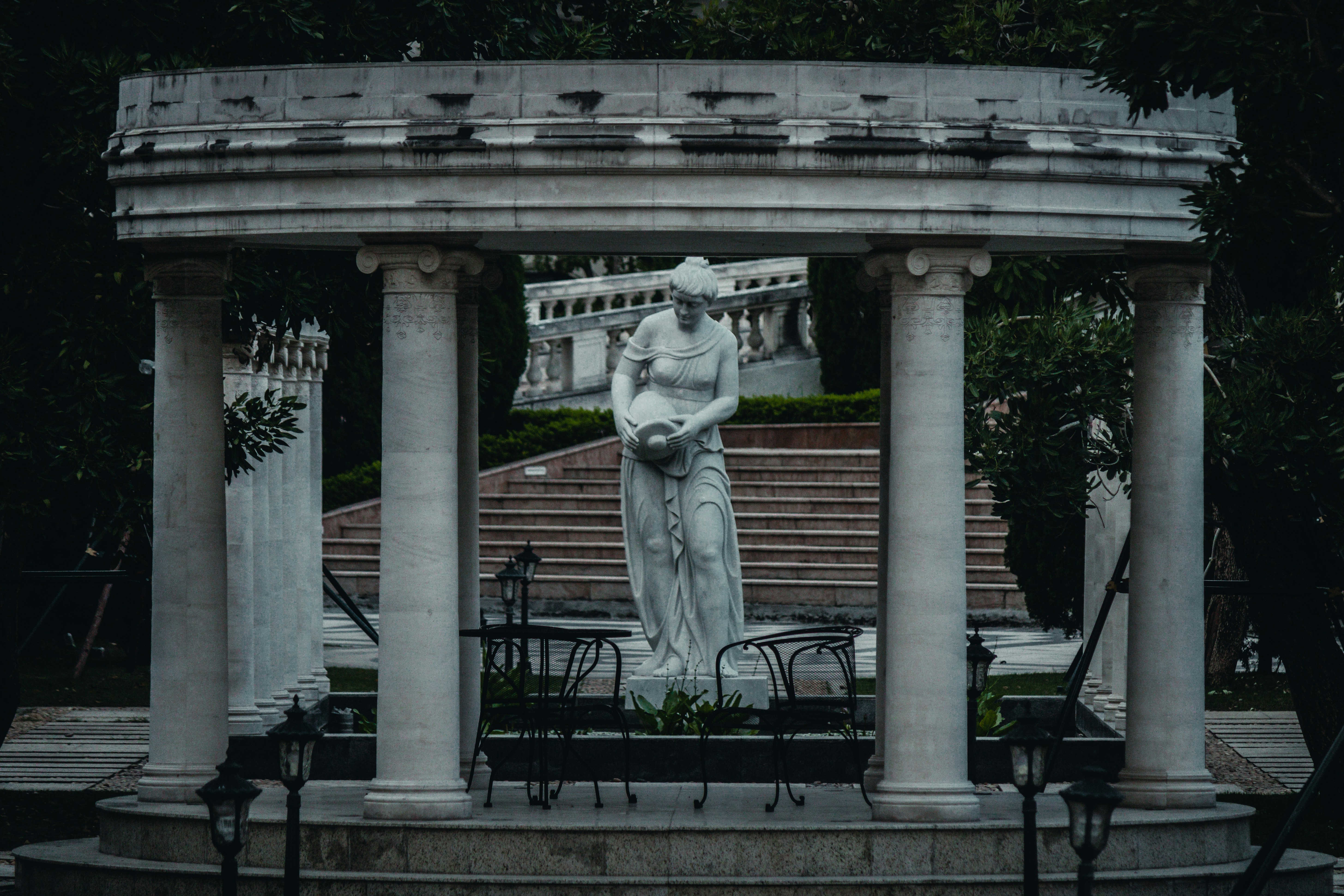 Marble statue of a woman in a classical temple
