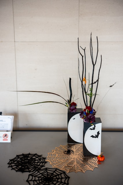 Halloween decorations with spiderwebs and bare branches.