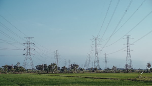 Electric towers and power lines across open fields