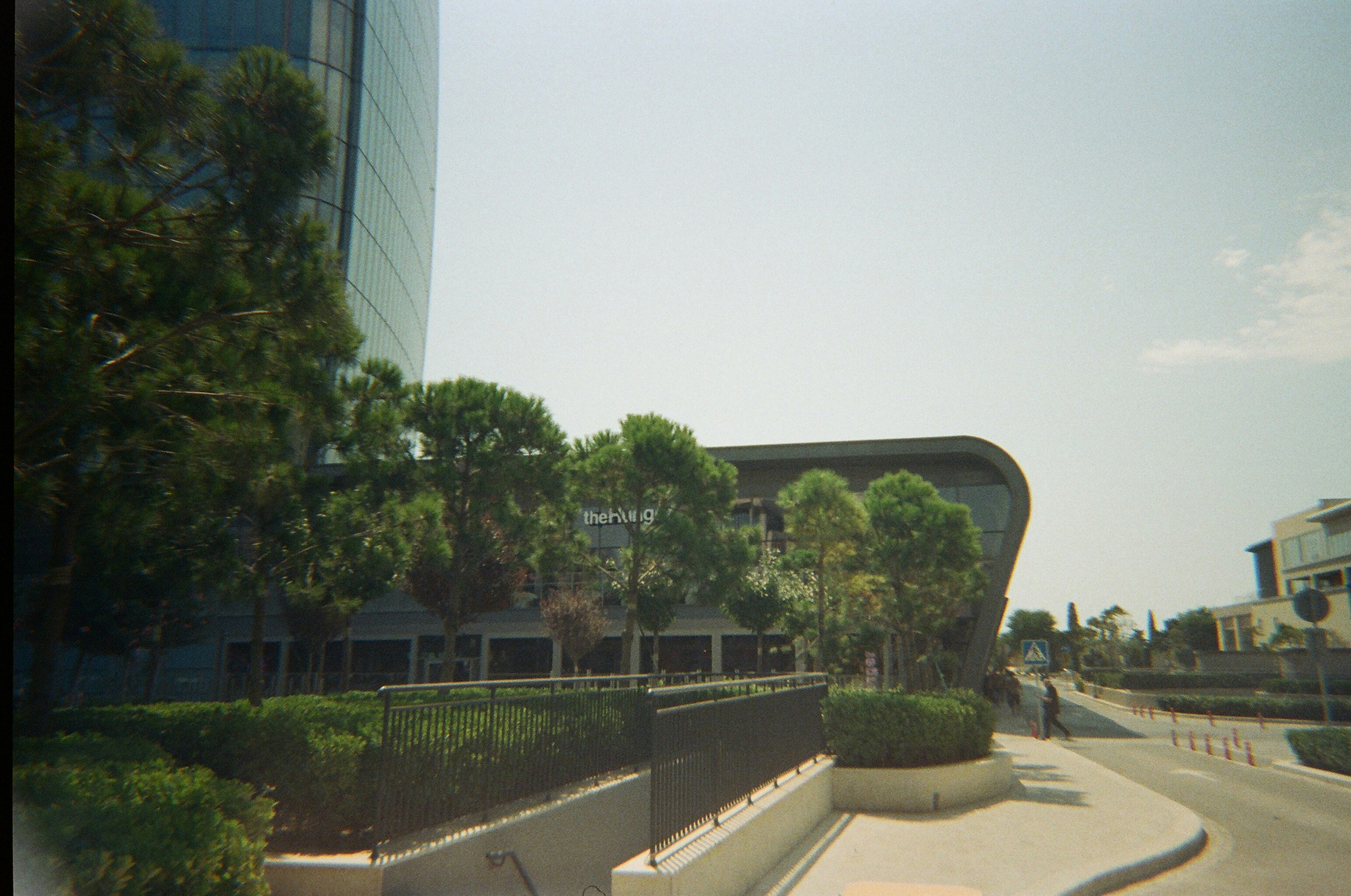 Modern building with trees and a street