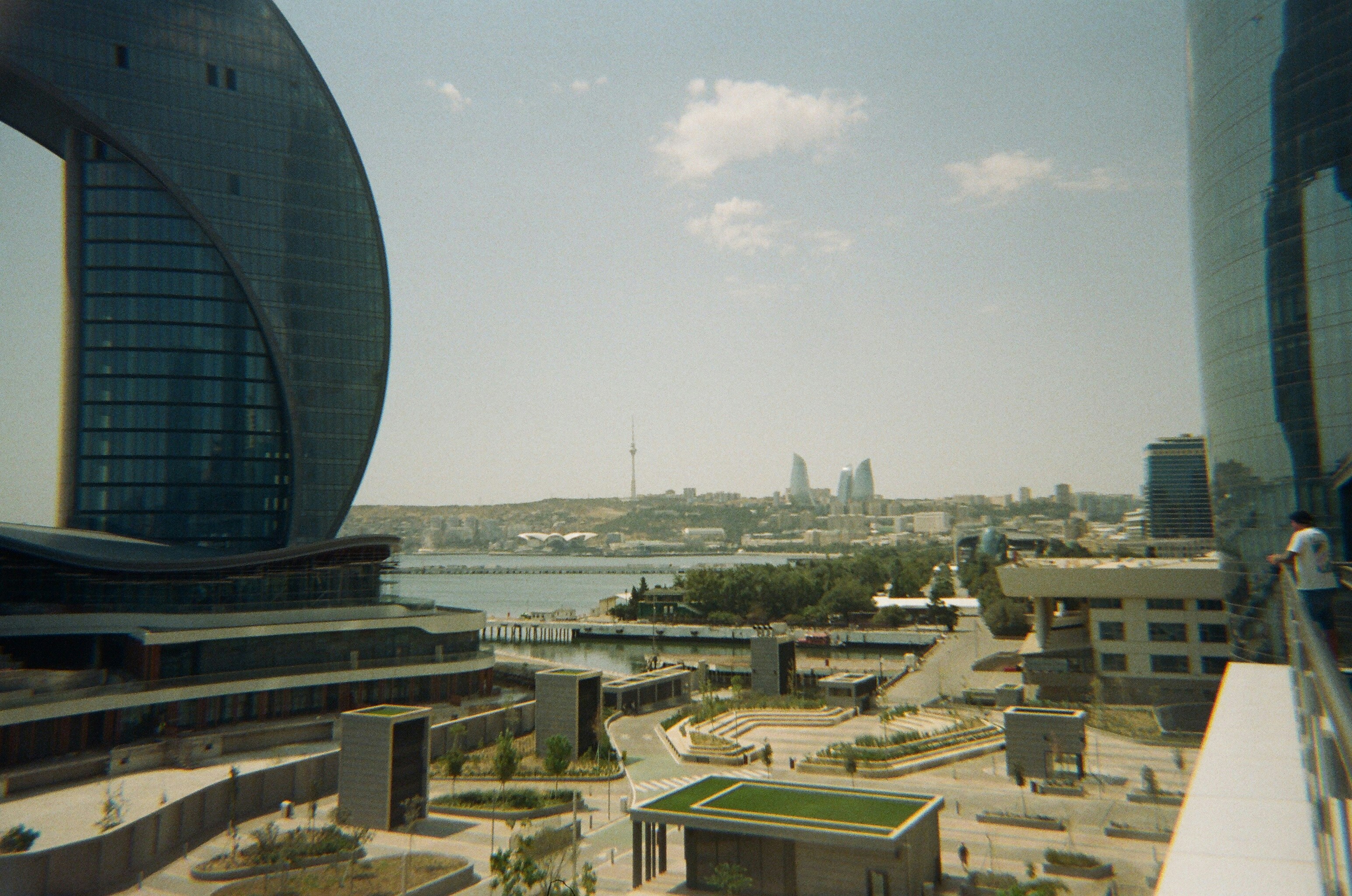 Modern cityscape with distinctive architecture and waterfront.