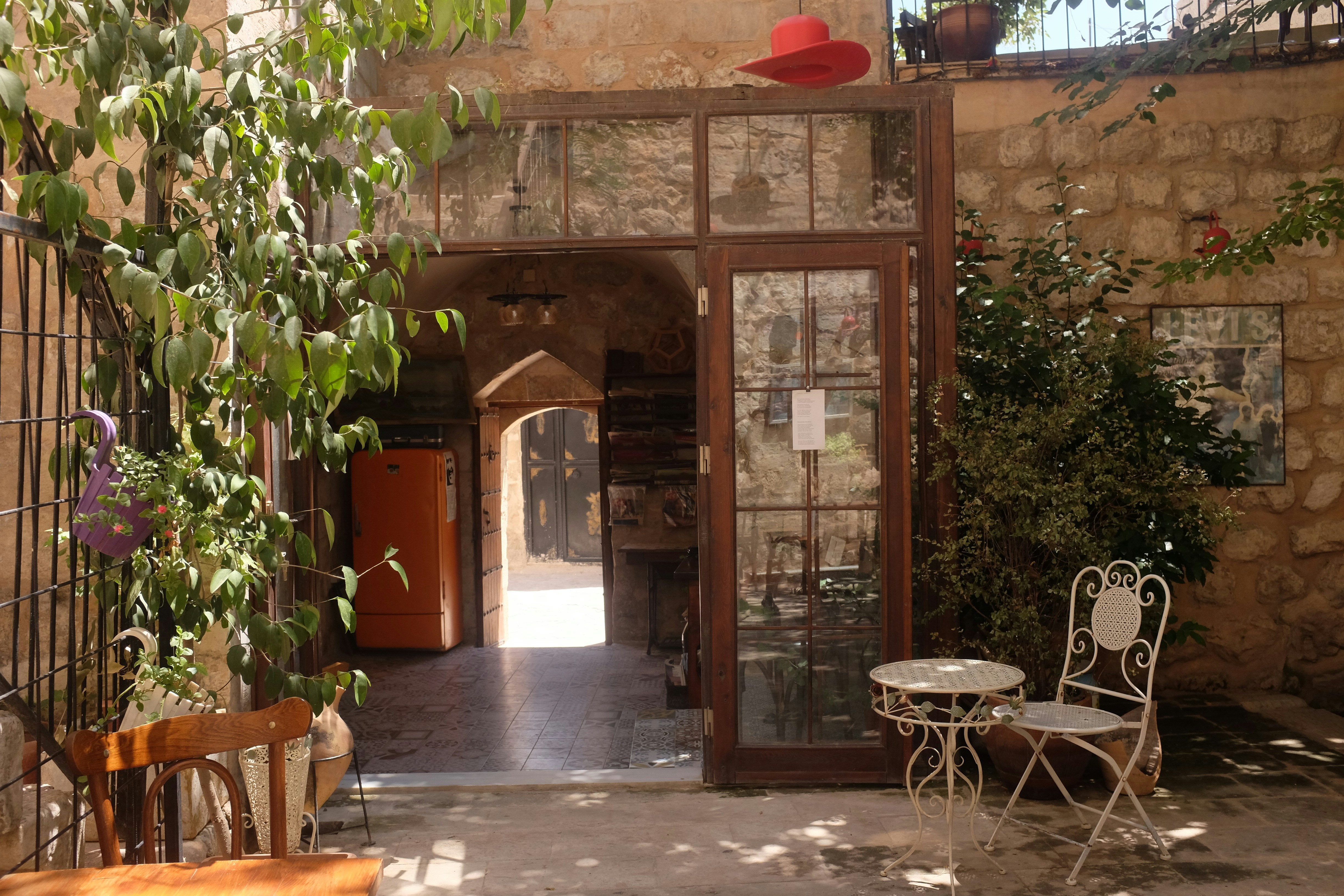 Courtyard entrance with chairs and plants