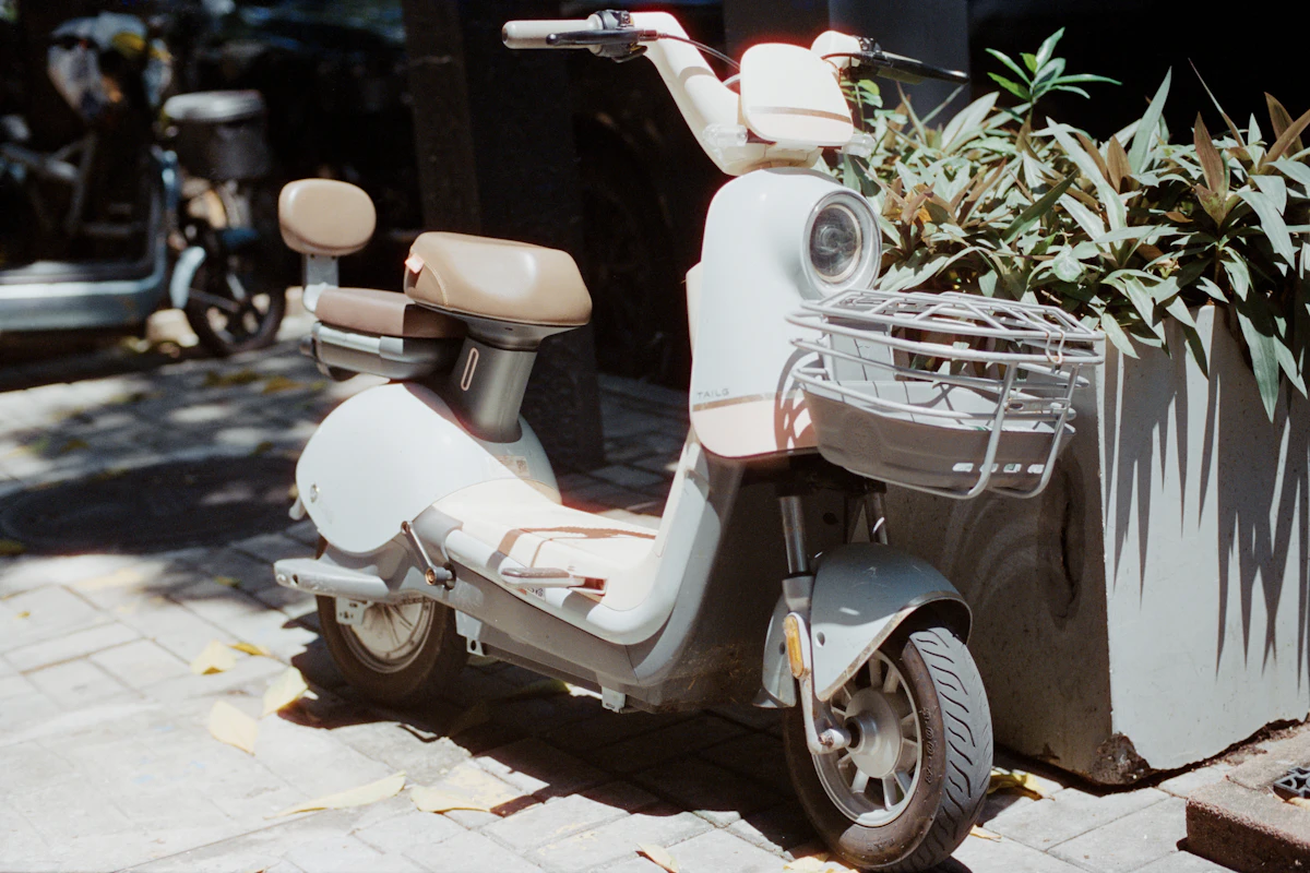 White electric scooter on a sidewalk