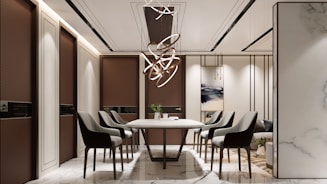 Modern dining room with elegant chairs and chandelier.