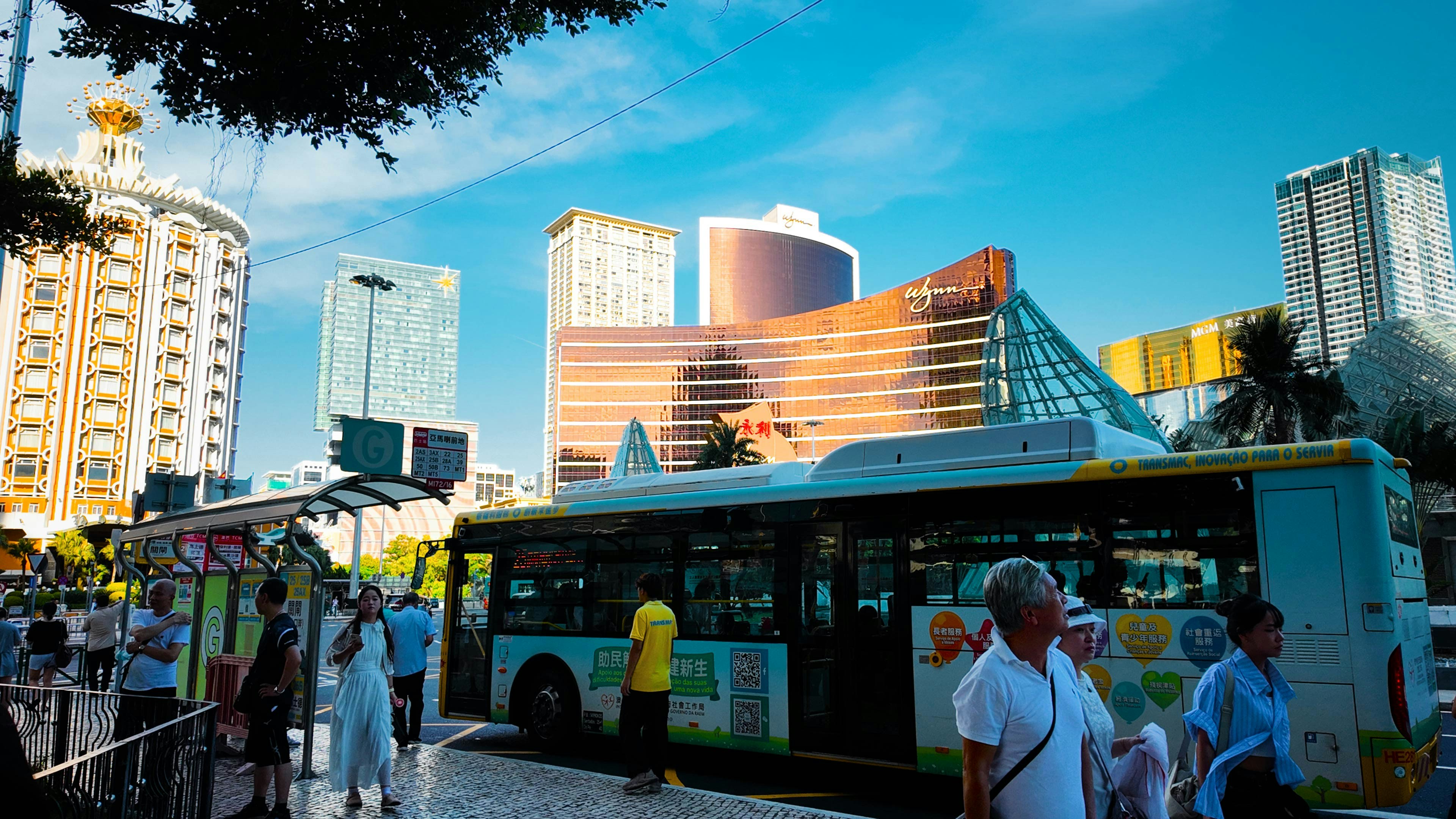 Bus on street with modern buildings in background