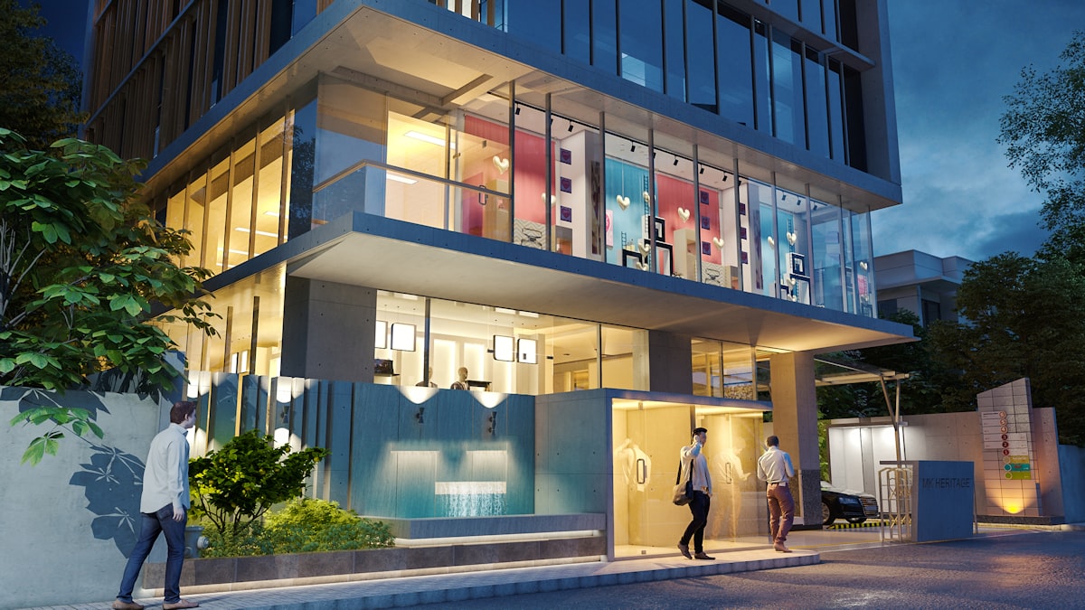 Modern commercial building entrance with people walking inside