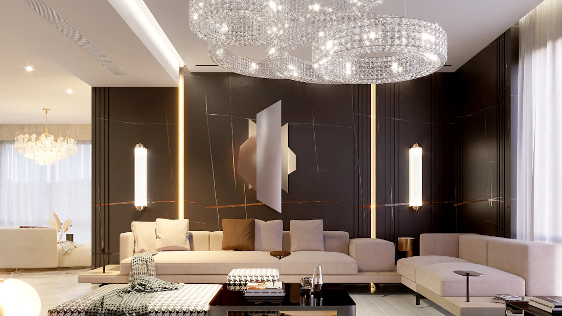 A generous open living space with pale seating beneath a wide sculptural ceiling light.