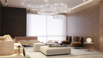 Modern living room with elegant chandeliers and comfortable seating.