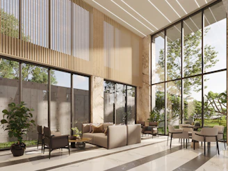 Modern lobby with large windows and comfortable seating.
