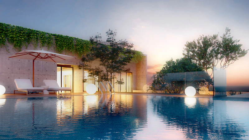Infinity pool at sunset with lounge chairs