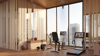 Modern gym with exercise equipment and city view