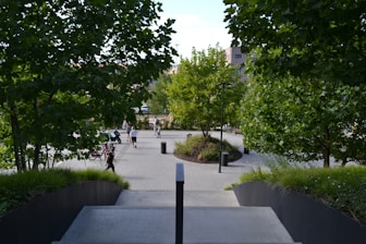 People walking and jogging in a modern urban park.