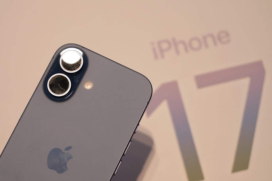 Close-up of an iPhone 17 rear camera system showing the dual-lens configuration used for HEIC photo capture by default