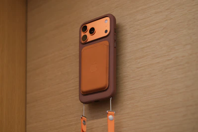 Smartphone case with attached wallet and lanyard
