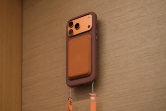 Smartphone case with attached wallet and lanyard