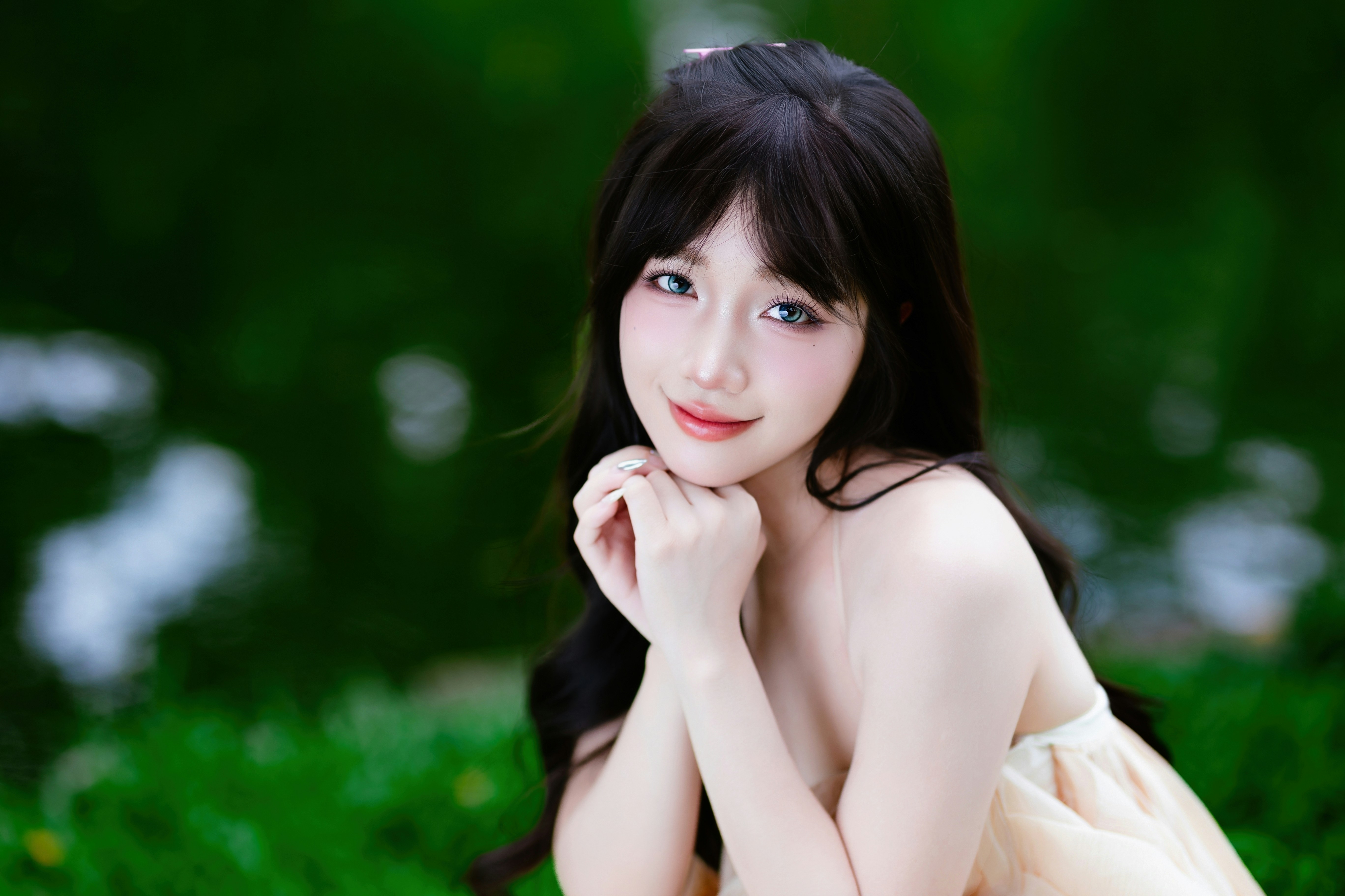 Portrait of a young woman in a flowing cream dress