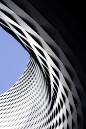 Modern architectural structure with geometric patterns against sky