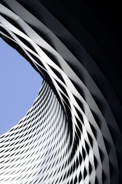 Modern architectural structure with geometric patterns against sky