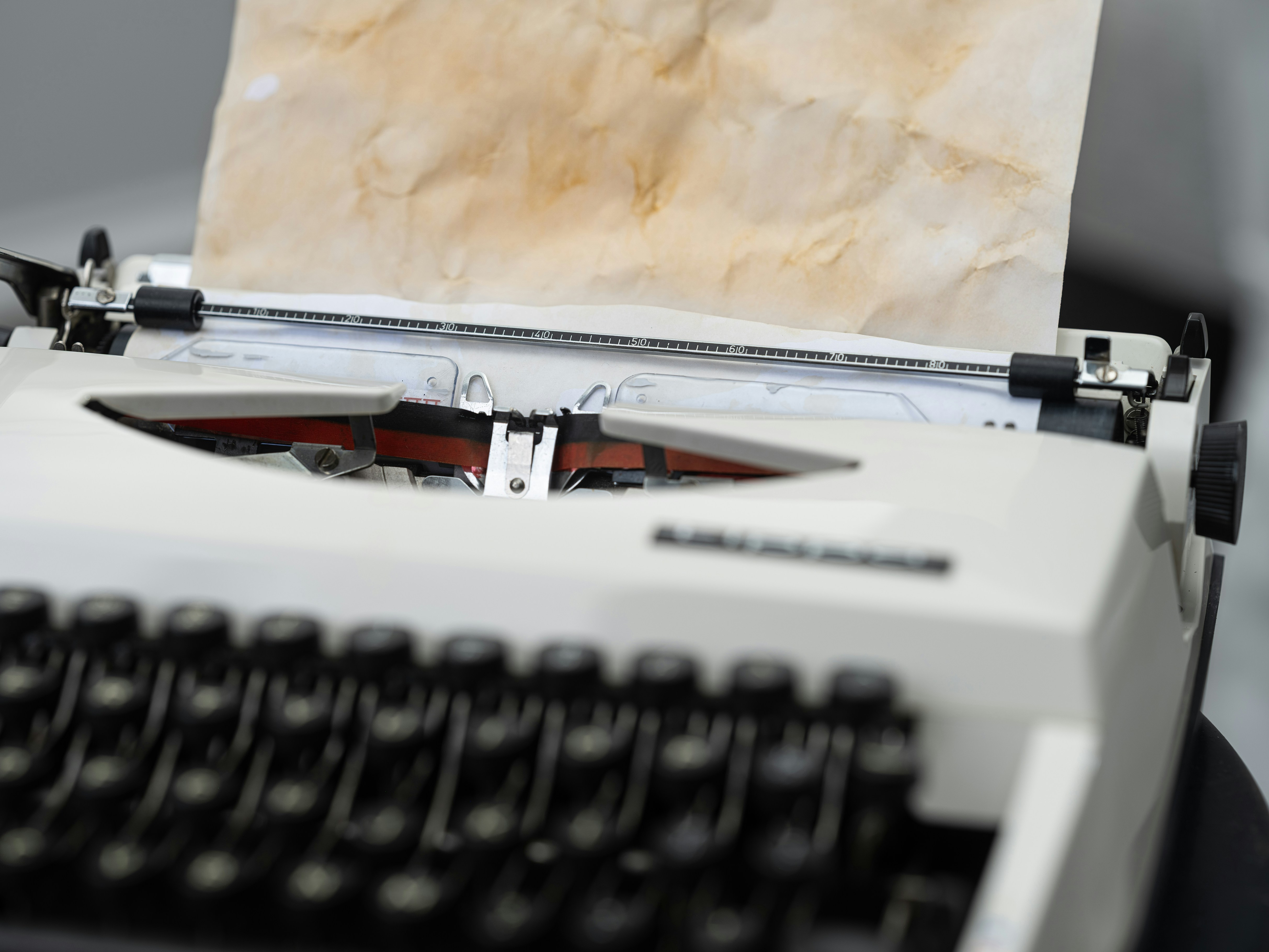 old typewriter with antique paper