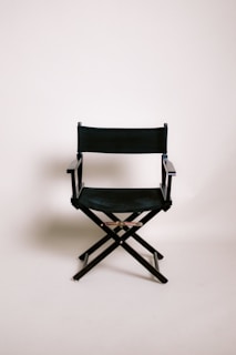 A black director's chair on a white background.