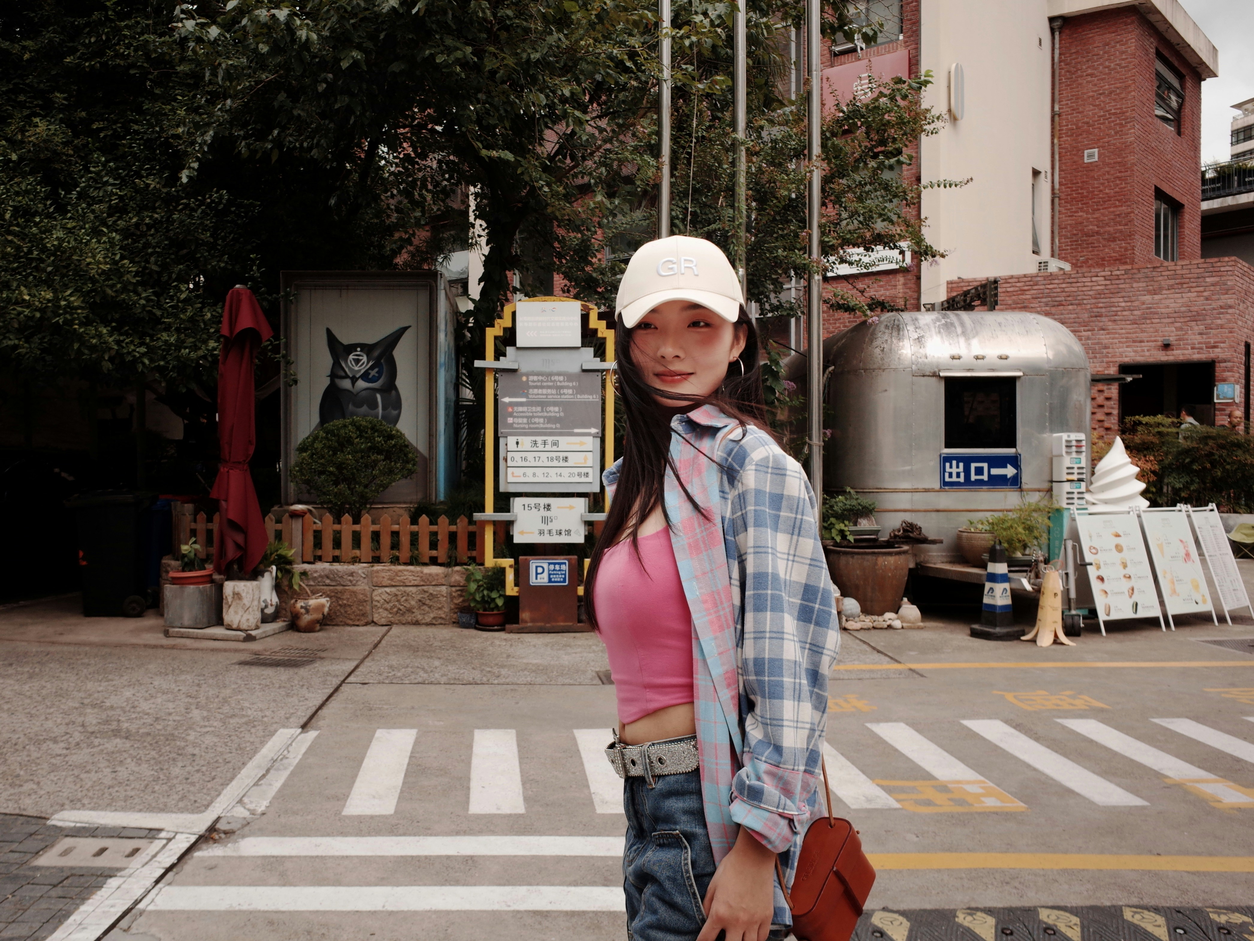 Young woman in a white cap and plaid shirt