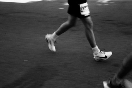 Runner's legs in motion during a race