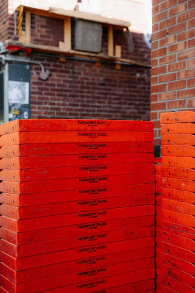Stack of bright orange construction panels