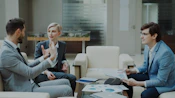 Three business people in a meeting