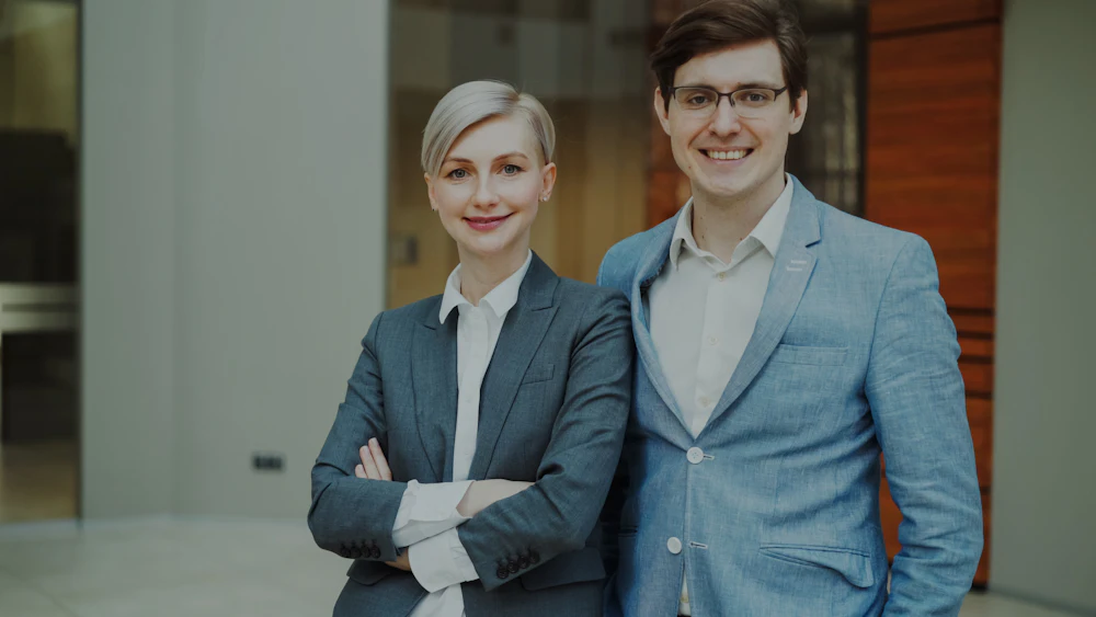 Real estate agents smiling in an office