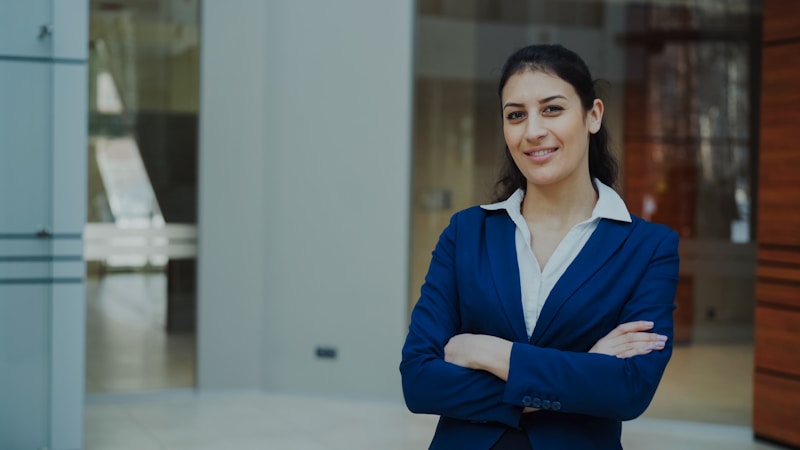Confident businesswoman in blue suit