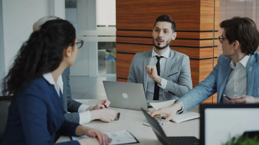 Business professionals reviewing information in a meeting