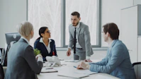 Business professionals in a meeting around a table