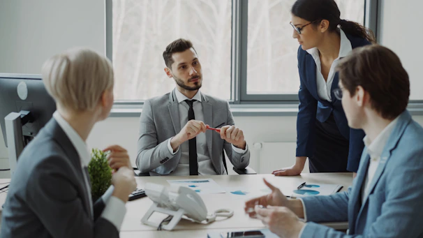 Business professionals collaborating around a conference table.