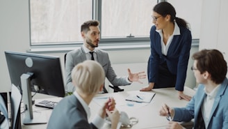 Business professionals collaborating in a modern office meeting.