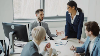 Business professionals collaborating in a modern office meeting